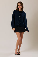 SUETER DE PUNTO NAVY CON BOTONES PERLA